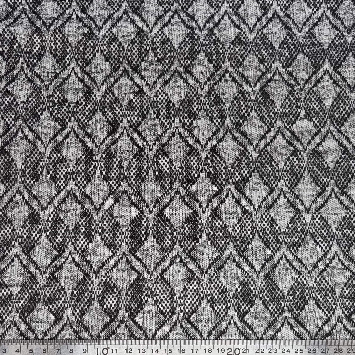 Textured fabric with a geometric pattern in black and gray