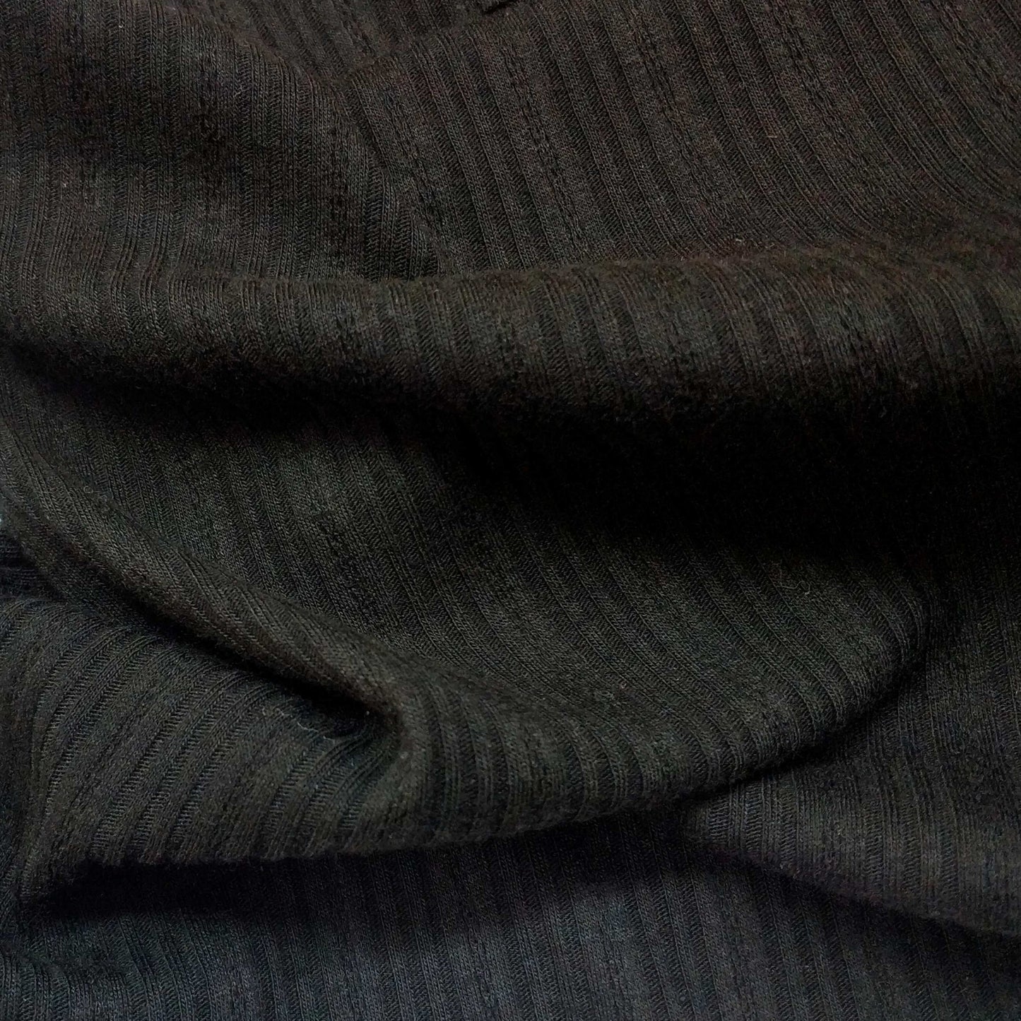 Ribbed knit fabric inspired by the soft texture and stretch of classic undershirts in black