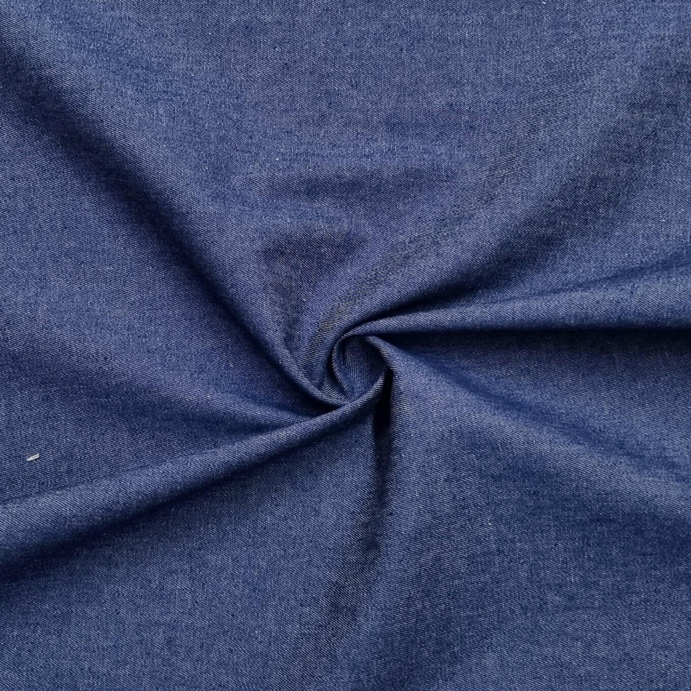 A washed lightweight denim fabric in medium blue