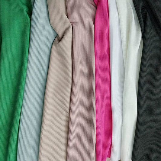 Collection of ribbed fabric swatches in various colors.