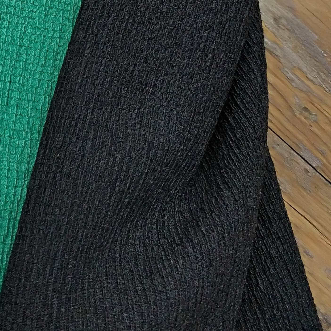 Crepe-Style Knit Featuring A Gentle Crinkled Texture In Black Color