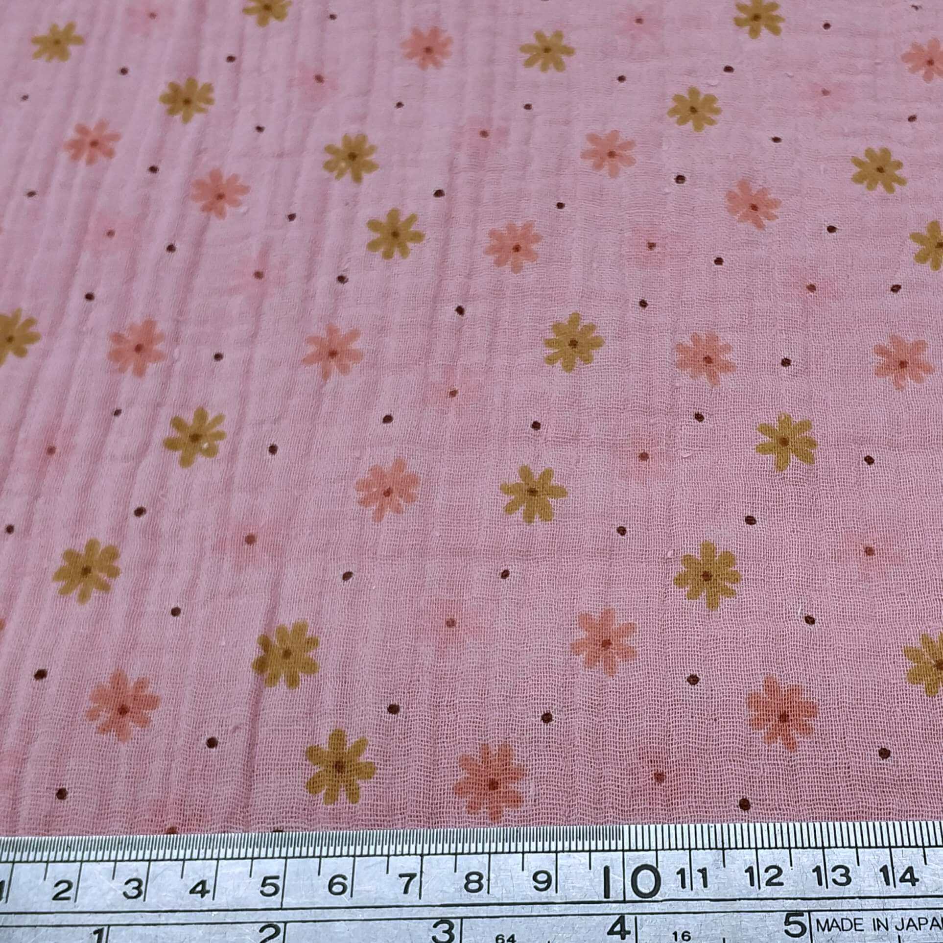 Floral patterned fabric on a pink bakround