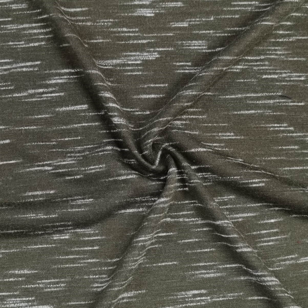 Green Fabric With White Speckles