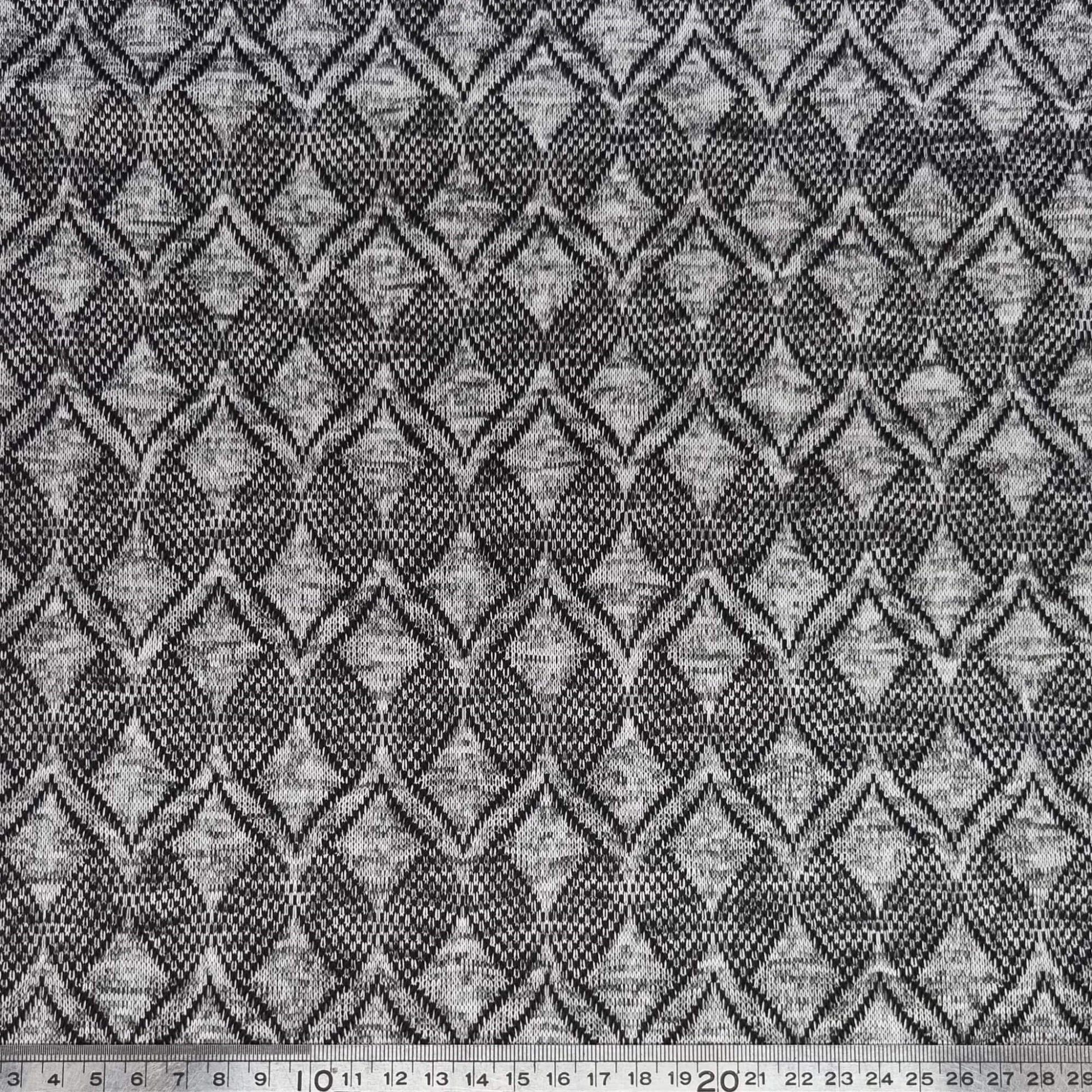 Textured fabric with a geometric pattern in black and gray