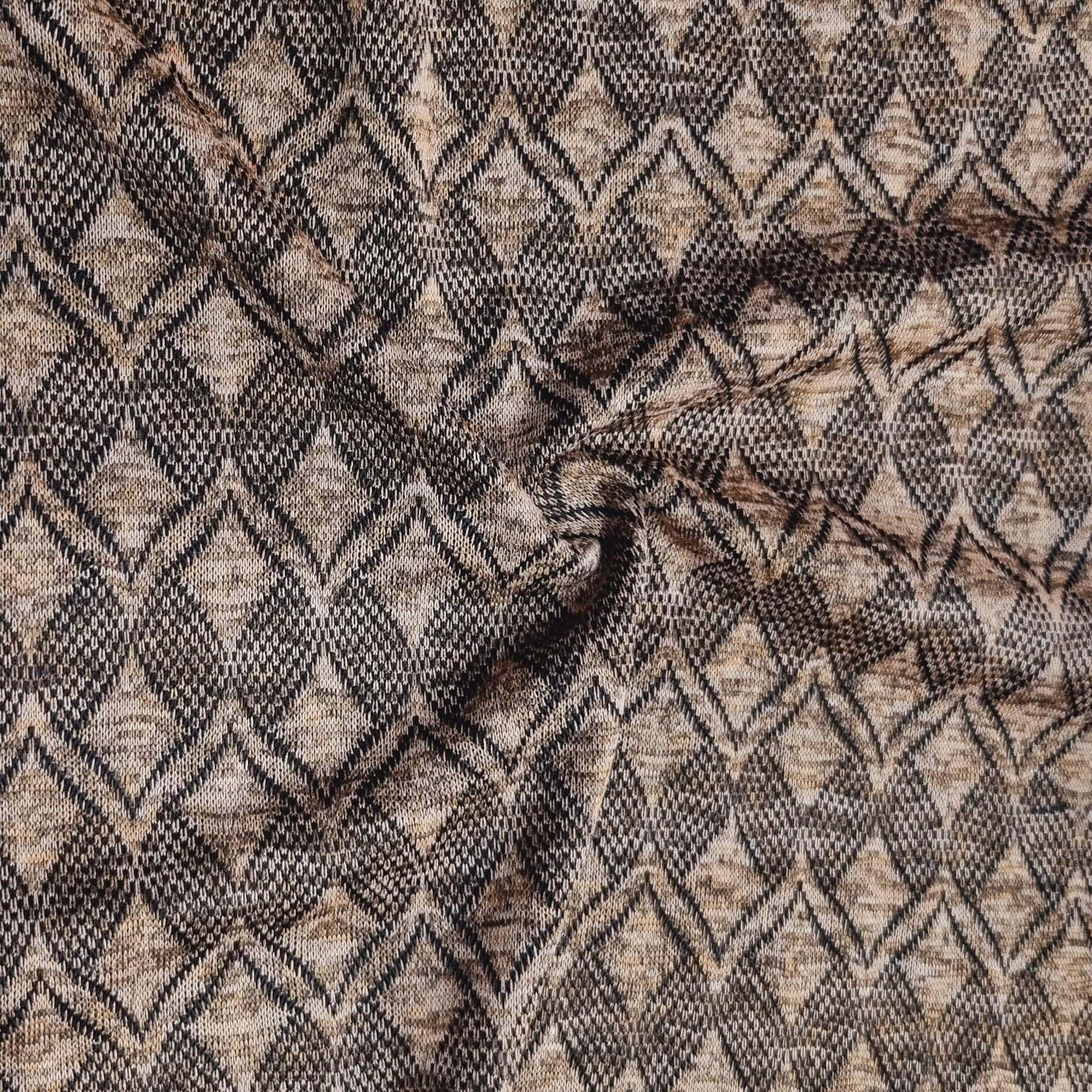 Textured fabric with a geometric pattern in black and brown
