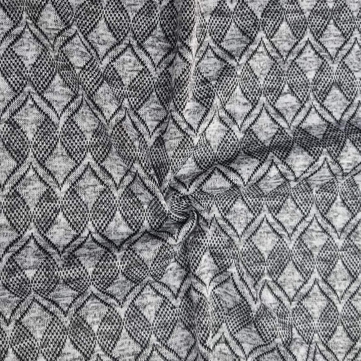 Textured fabric with a geometric pattern in black and gray