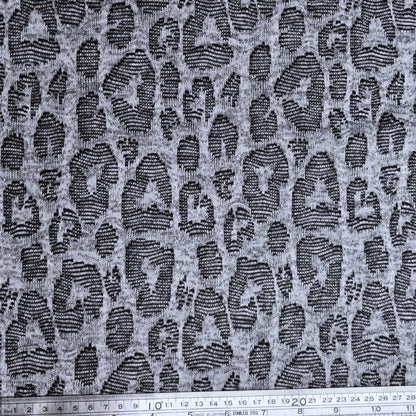 Jacquard fabric with a leopard print pattern in gray