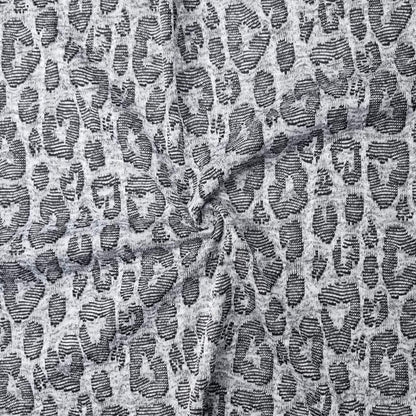 close-up of Jacquard fabric with a leopard print pattern in gray