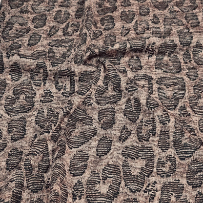 close-up of Jacquard fabric with a leopard print pattern in brown