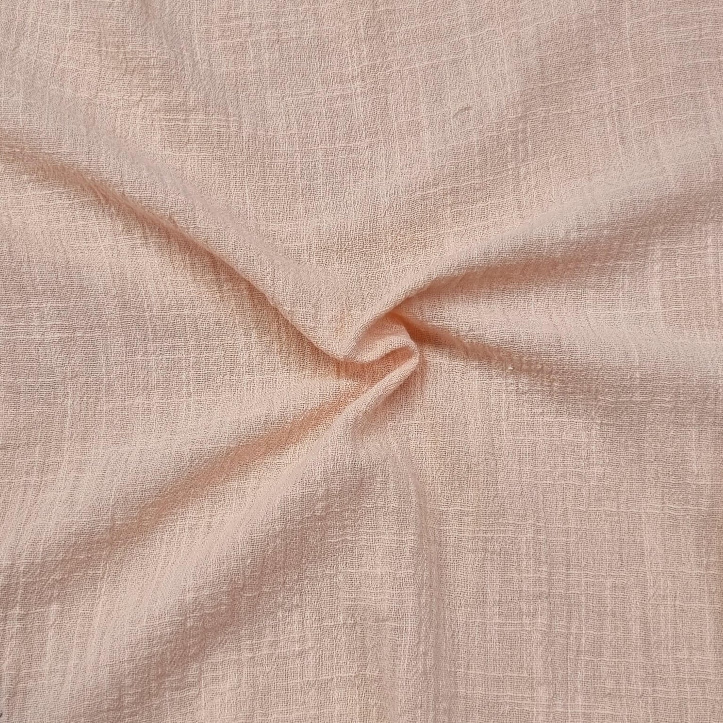 Fabric With A Textured Pattern In Peach