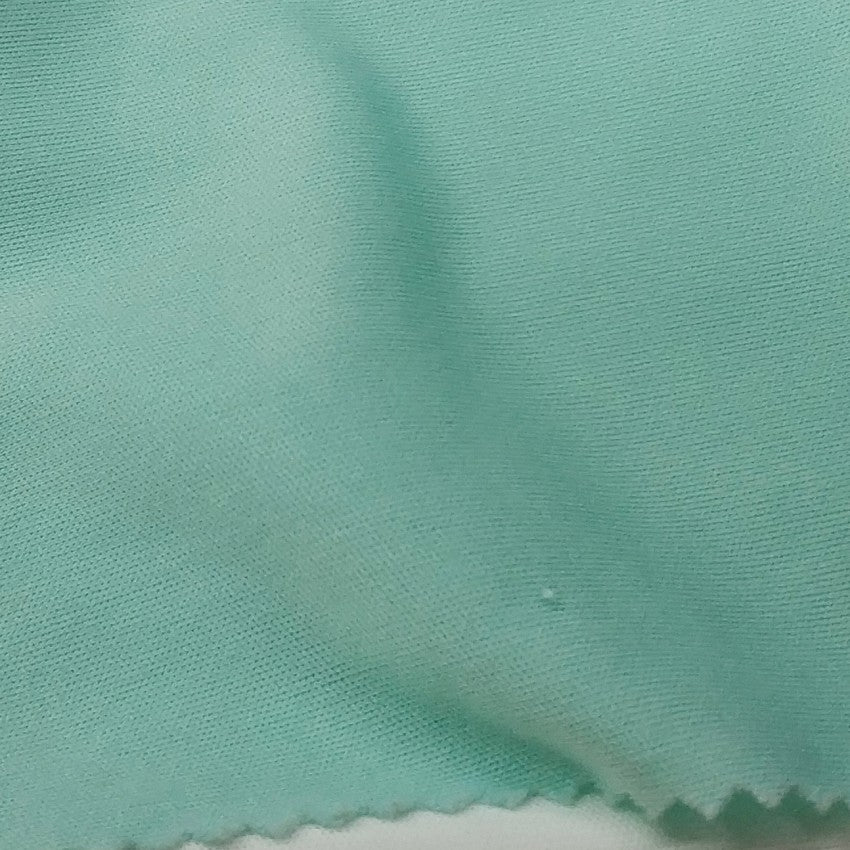 Light Green Fabric With A Smooth Texture