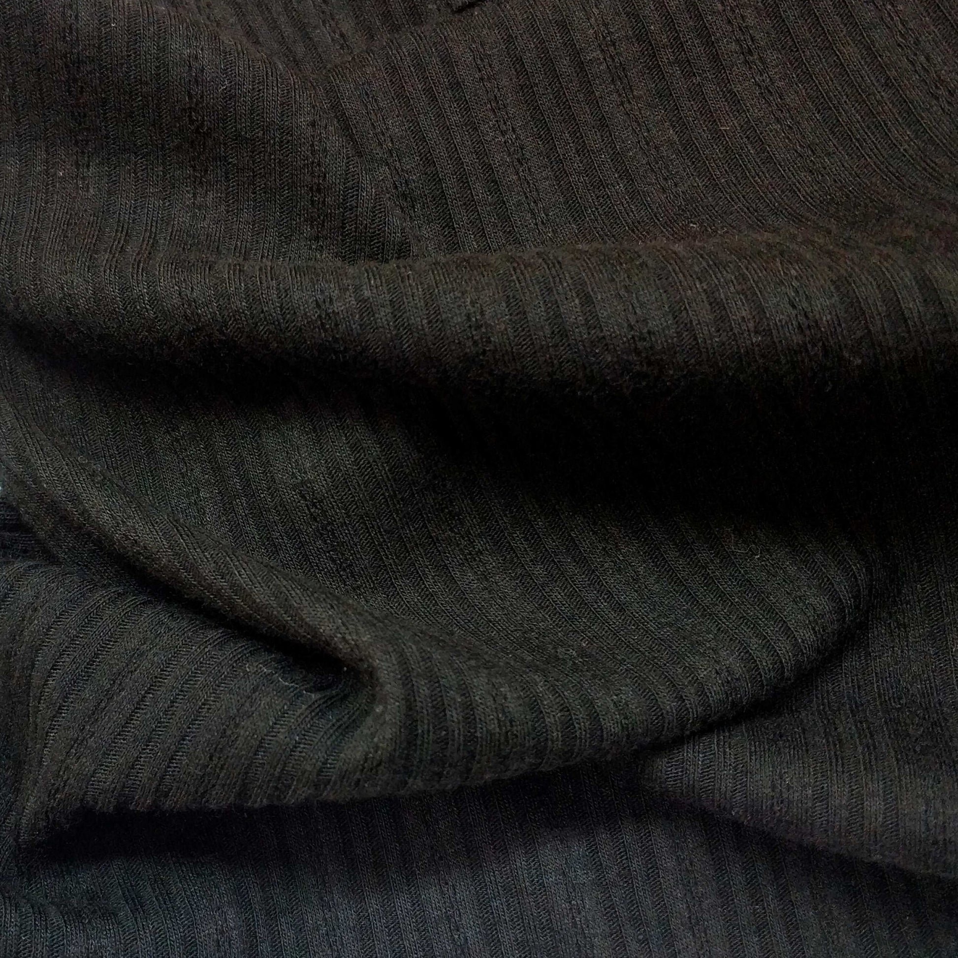 Ribbed knit fabric inspired by the soft texture and stretch of classic undershirts in black