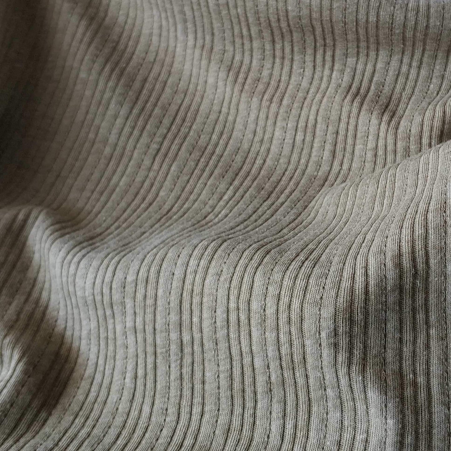 Ribbed knit fabric inspired by the soft texture and stretch of classic undershirts in green