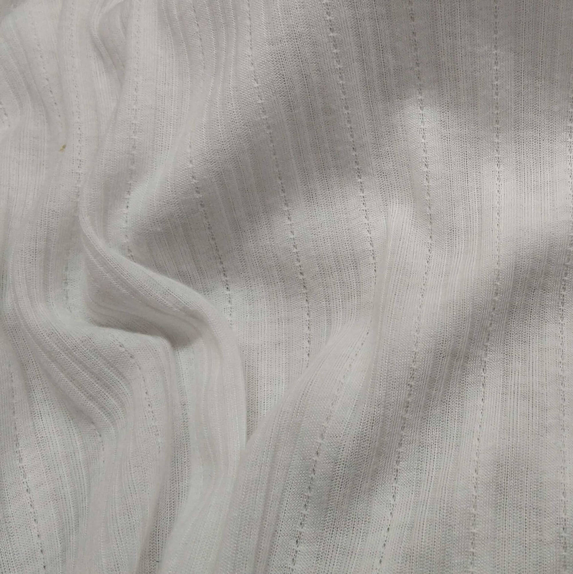 Ribbed knit fabric inspired by the soft texture and stretch of classic undershirts in off white