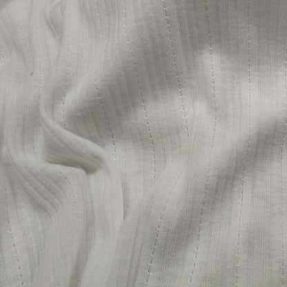 Ribbed knit fabric inspired by the soft texture and stretch of classic undershirts in off white