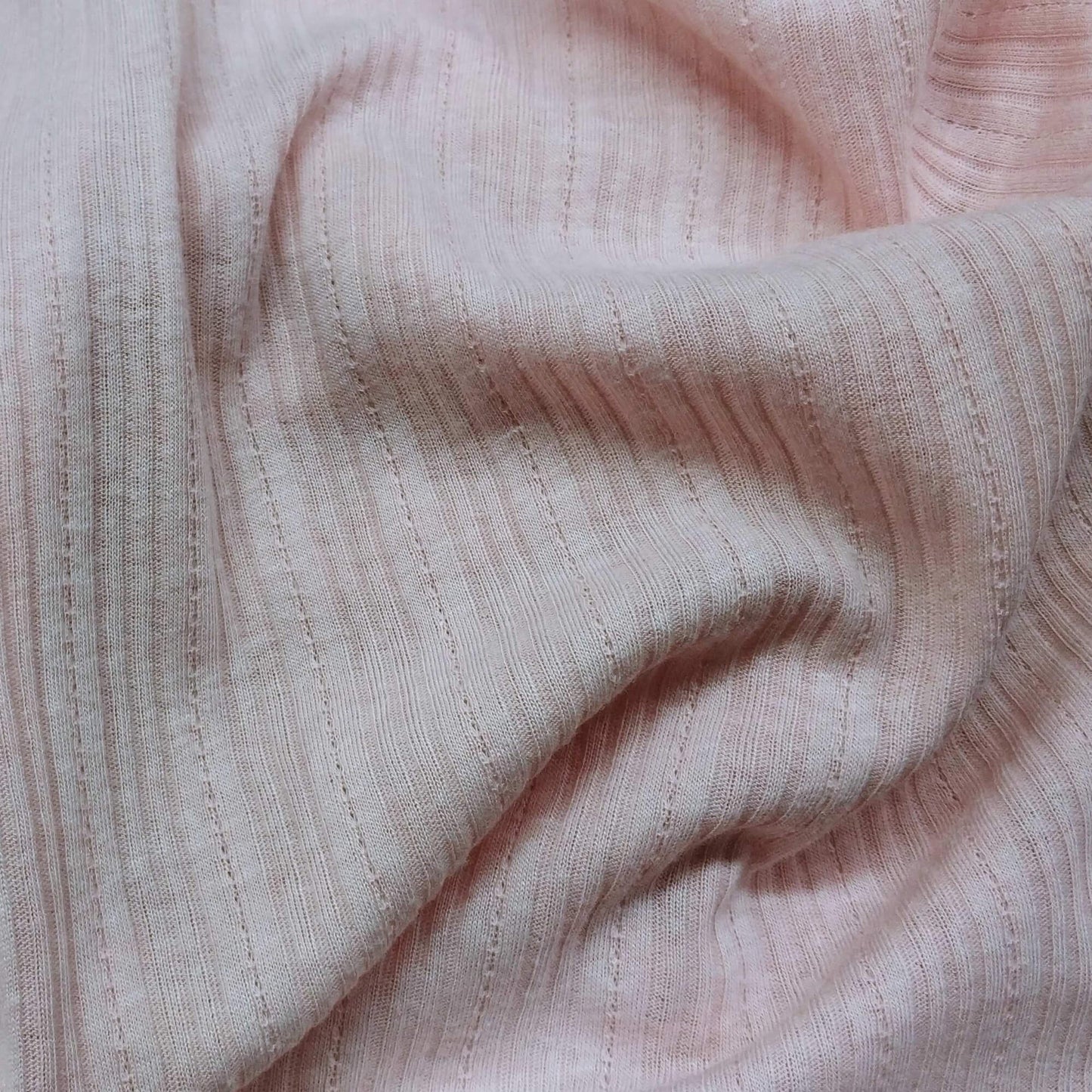 Ribbed knit fabric inspired by the soft texture and stretch of classic undershirts in pink