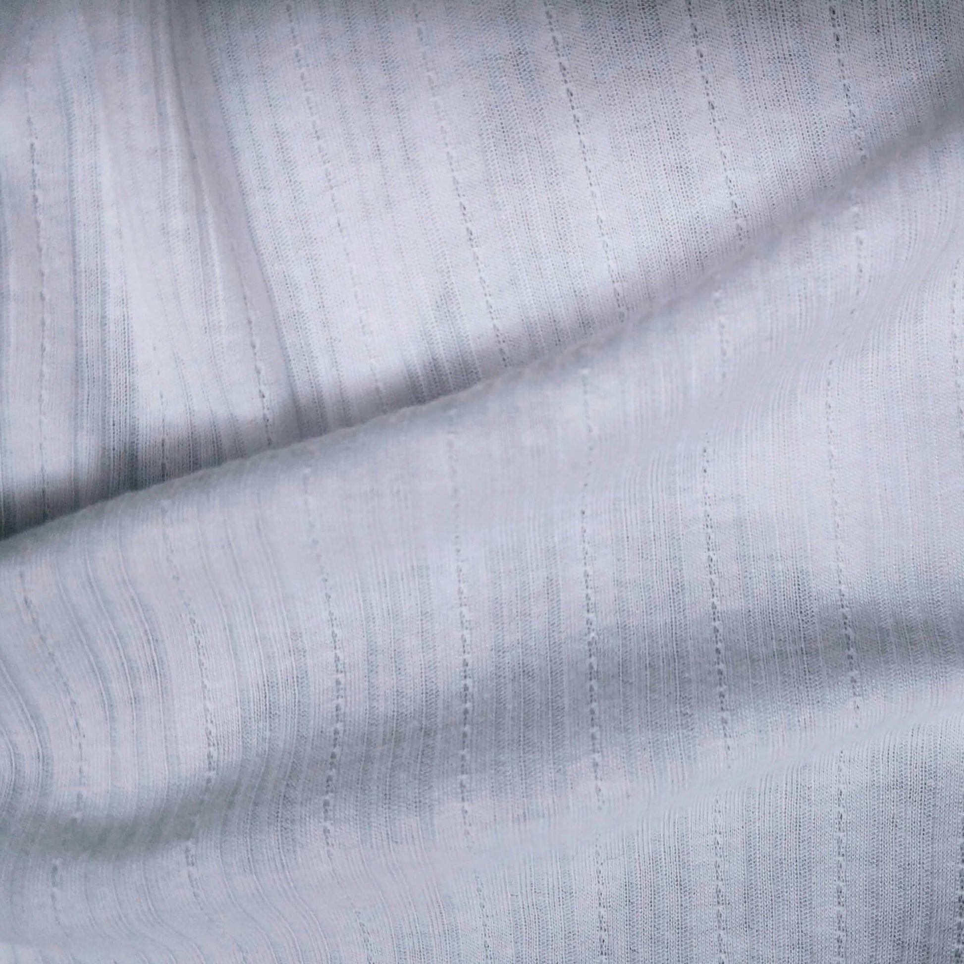 Ribbed knit fabric inspired by the soft texture and stretch of classic undershirts in white