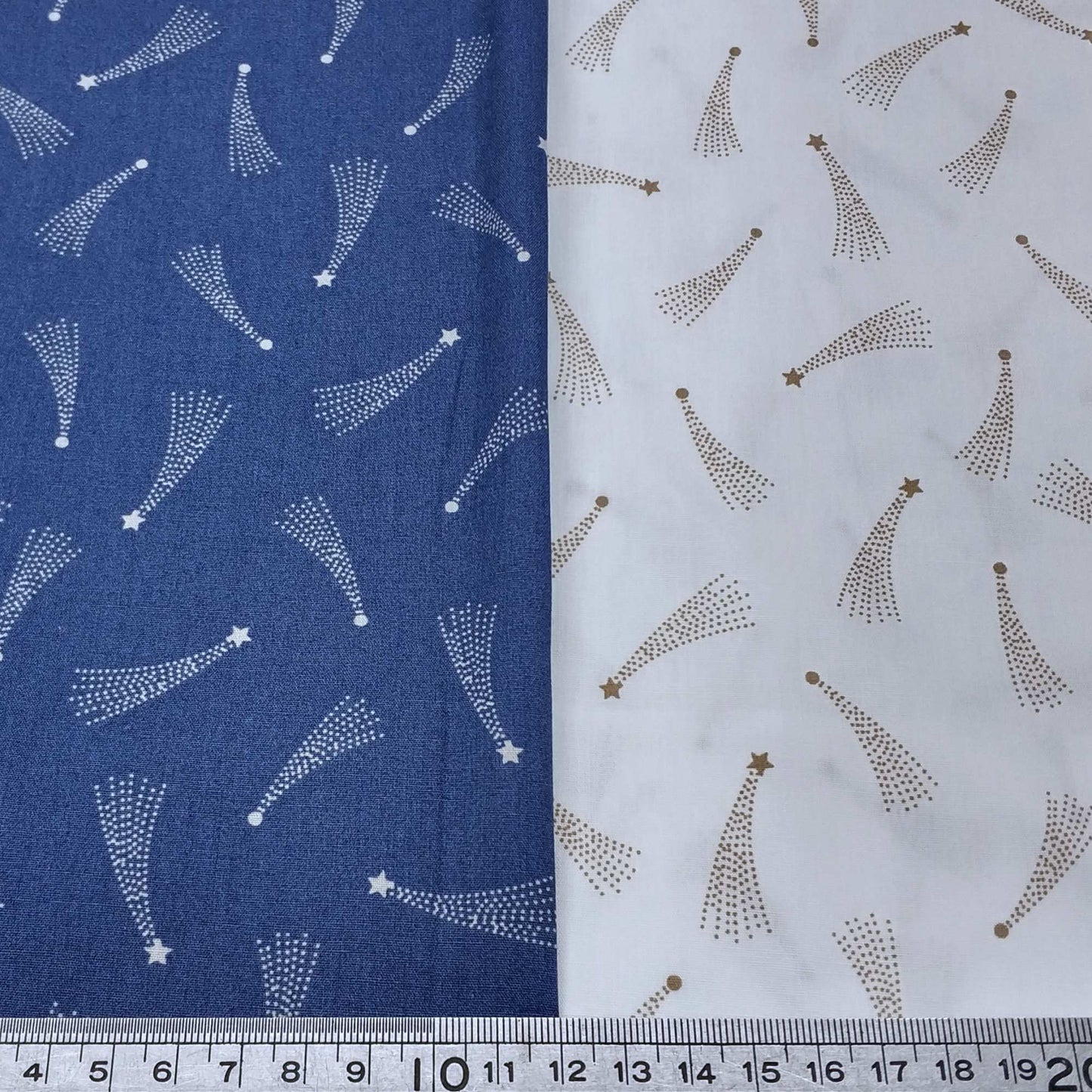 Two fabric swatches with starburst patterns on a blue and white background.