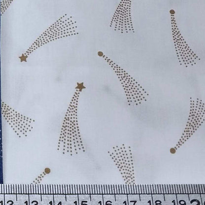 Pattern of gold stars and shooting stars on a white background 