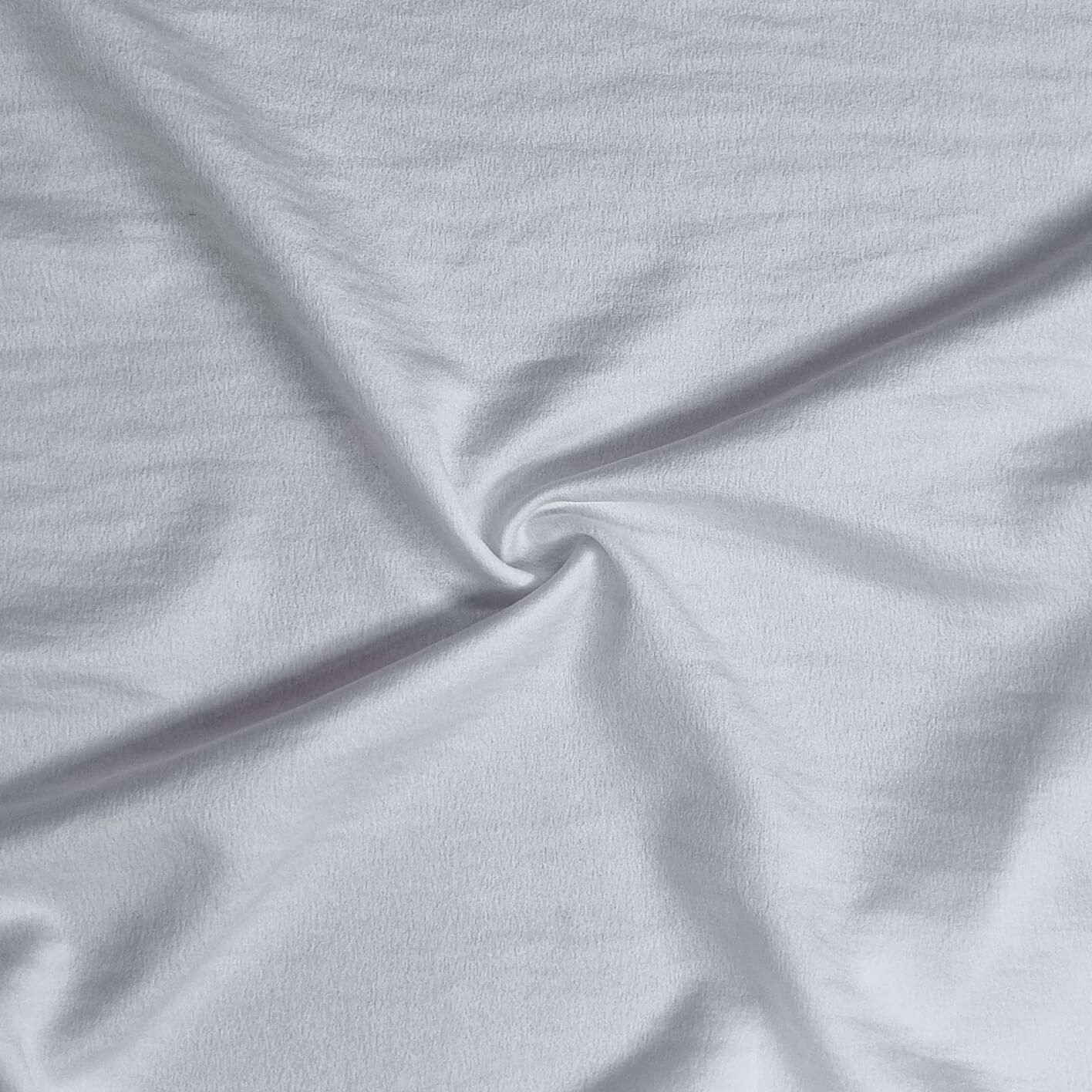 Woven fabric with a slightly crinkled and sand‑washed texture in ivory