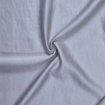 Woven fabric with a slightly crinkled and sand‑washed texture in silver