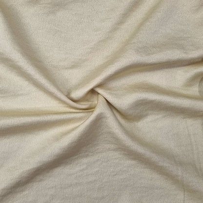 Woven fabric with a slightly crinkled and sand‑washed texture in yellow