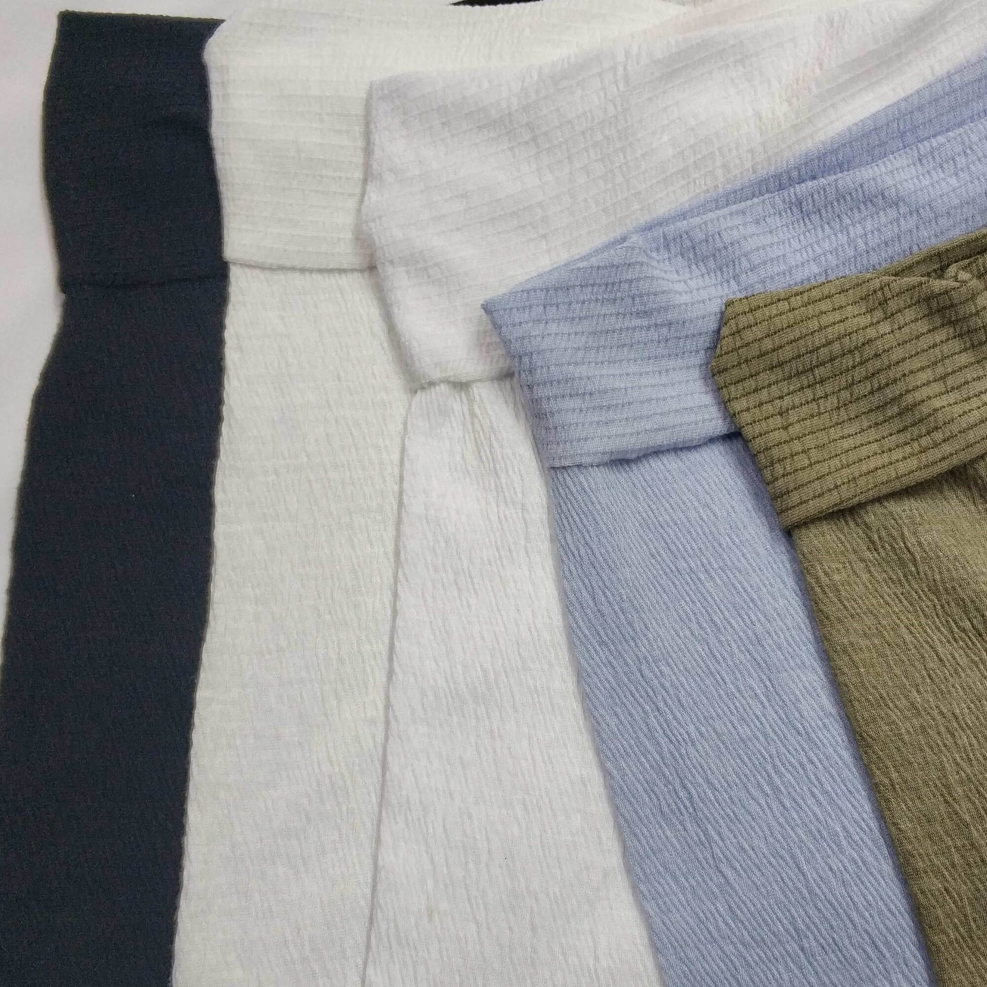 Varius colors of stretch knit fabric with a textured surface