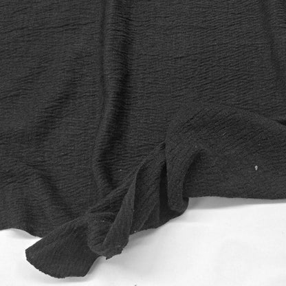 Black knit fabric with a textured surface