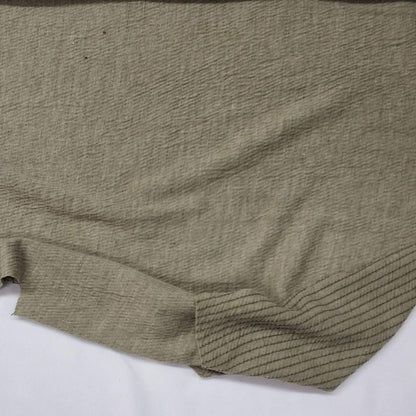 Green knit fabric with a textured surface