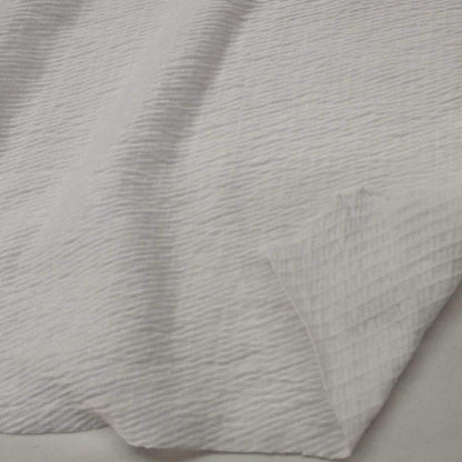 Ivory knit fabric with a textured surface