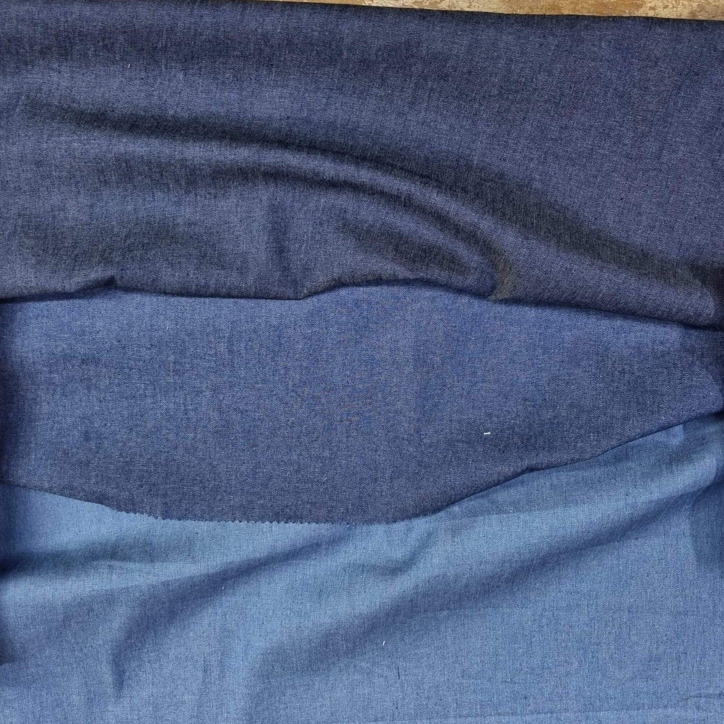 A washed lightweight denim fabric